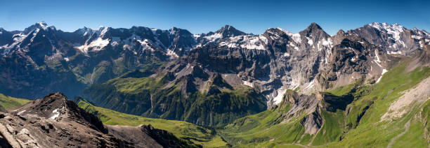 Switzerland Travel - Panoramic view of Jungfrau region of the Swiss Alps from the top of Schilthorn stock photo