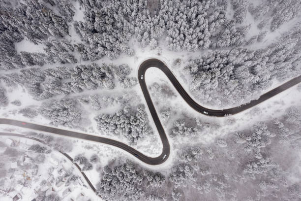 istock Drone view at mountain road at winter 1483251649