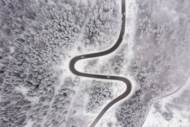 istock Drone view at mountain road at winter 1483251652