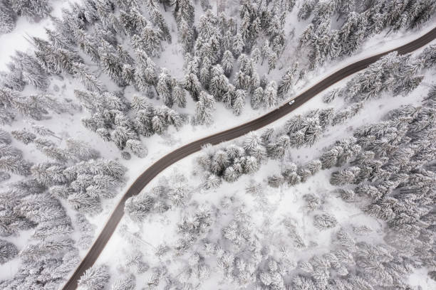 istock Drone view at mountain road at winter 1483251679