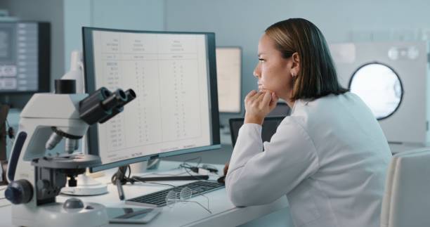 istock Medical, research and woman reading, computer and data analysis in laboratory, scientist and focus. Female researcher, employee and professional in lab, healthcare and innovation for experiments 1483251791