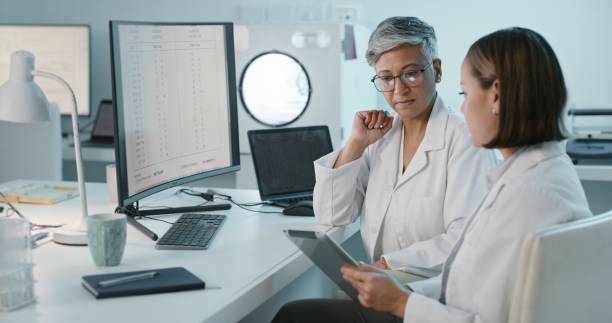 istock Science, tablet or computer with a woman and student in laboratory for research or innovation. Collaboration, data and study with a scientist team working in a lab for discovery or breakthrough 1483251814