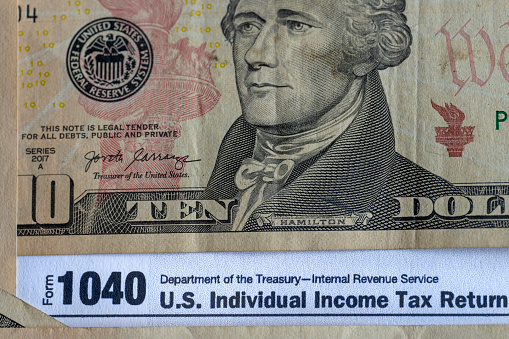 Benjamin Franklin peeking through 50 dollar banknotes for design purpose