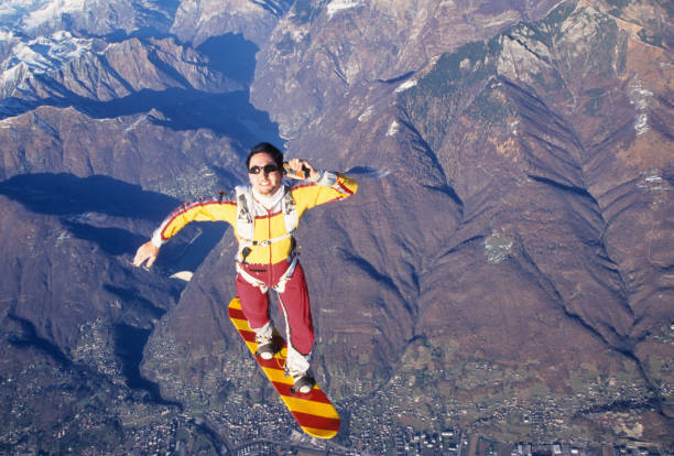 istock Skydiver surfs the air on a skyboard 1483255608