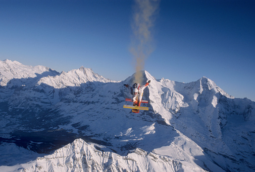 Smoke trails off the back of the skyboarder