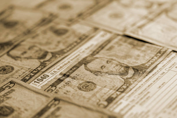 IRS form 1040 and dollars still life background.