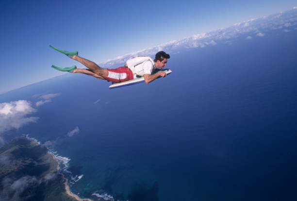 Skydiver surfs the air on a skyboard
