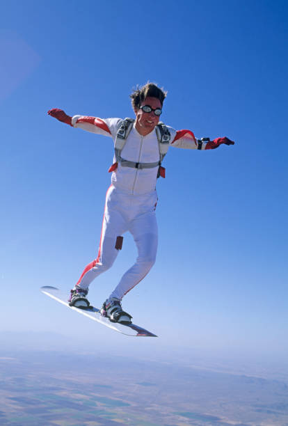 skydiver naviga in aria su uno skyboard - skydiving air aerial view vertical foto e immagini stock