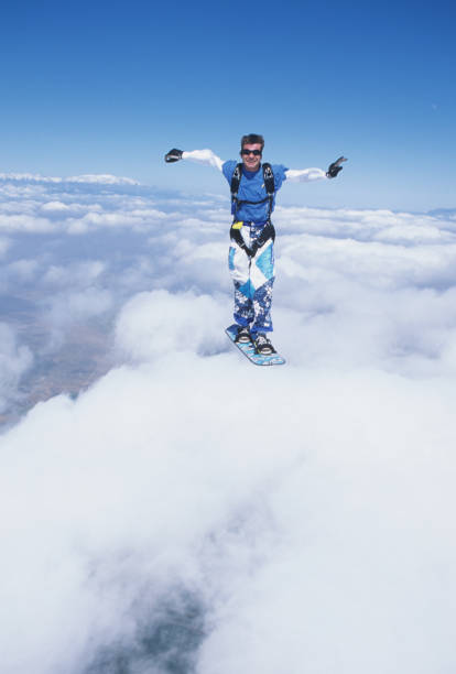 istock Skydiver surfs the air on a skyboard 1483257353