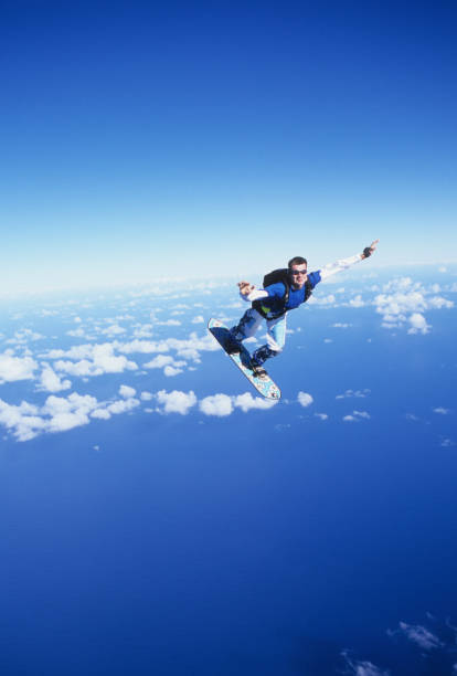 istock Skydiver surfs the air on a skyboard 1483257463