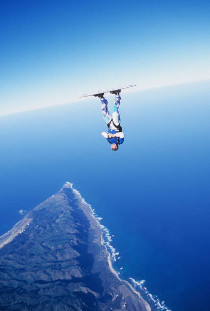 istock Skydiver surfs the air on a skyboard 1483257465
