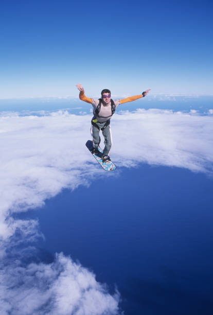 istock Skydiver surfs the air on a skyboard 1483257522
