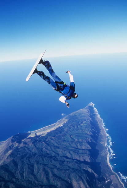 istock Skydiver surfs the air on a skyboard 1483257541