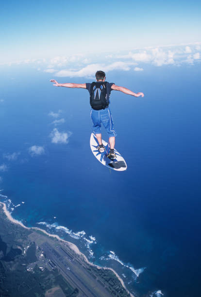 Skydiver surfs the air on a skyboard