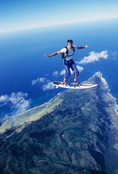 istock Skydiver surfs the air on a skyboard 1483257592