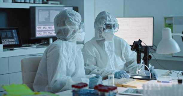 istock Collaboration, science and microscope with a doctor women team in a laboratory for covid research in ppe uniform. Teamwork, innovation and experiment with scientist females working together in a lab 1483263241