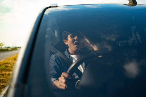 istock Young asian man has broken down car on the road he feeling serious and stressed. Look for someone help. Driving during rush hour But the traffic is very congested. Shocked face 1483265701
