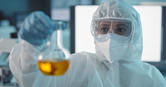 Hazcat Testing Scientist With Hazmat Suit Liquid Solution And Testing For Biohazard ...