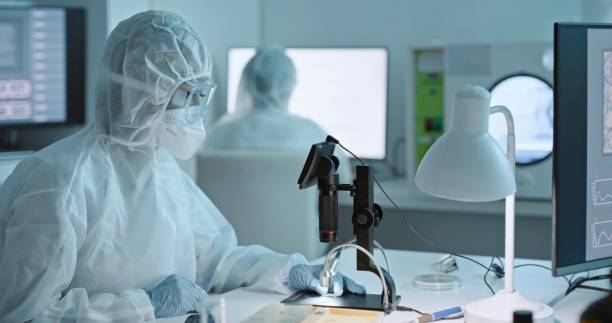 istock Health, medical research and protective gear in a laboratory with scientist worker doing work. Virus expert, working and safety in science lab with biohazard suit and doctor staff with mask from risk 1483266794