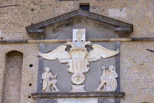 Naples, Italy - June 27, 2021: Castel Sant'Elmo, medieval fortress located on Vomero Hill. Relief of Imperial Eagle above the main gate