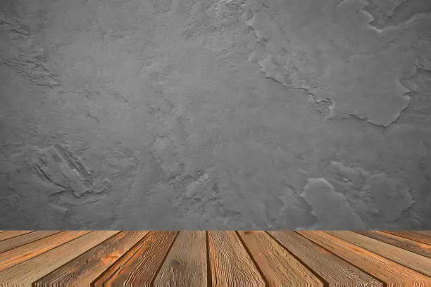 Mock up empty wooden table against on cement vintage feature background. Ideal for product display on top of the table.