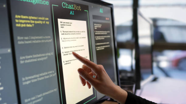 Artificial intelligence touch screen Close-up stock photograph showing a touchscreen monitor being used in an open plan office.
A woman’s hand is asking an AI chatbot pre-typed questions & the Artificial Intelligence website is answering. ai stock pictures, royalty-free photos & images