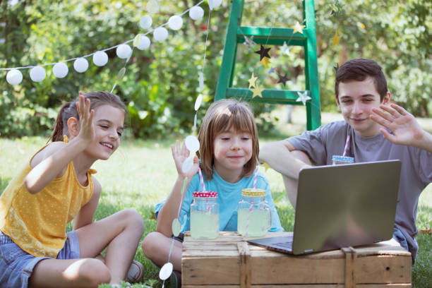 istock Happy children celebrating virtual birthday party at backyard 1483275267