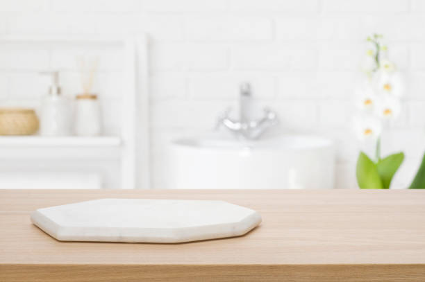 istock Marble podium for bathing product display on blurred bathroom background 1483276481