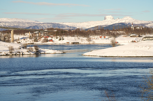 Country side with The Saltstraumen Bridge  across the fjord Saltfjorden  in Bodo territory in Nordland country, Norway. There is a small strait with one of the strongest tidal currents in the world.
