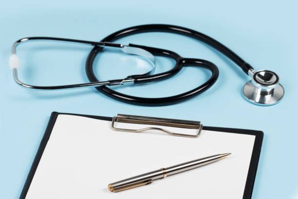 istock Stethoscope and pen laying on patient information blank 1483276580