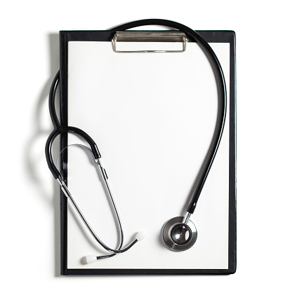 Blank medical clipboard with stethoscope on white background concept. Copy space