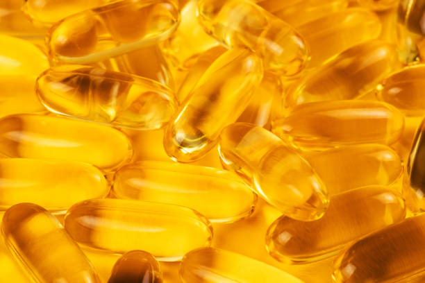 istock Fish oil capsules with omega 3 and vitamin D background 1483276869