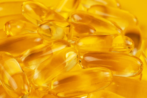 istock Fish oil capsules with omega 3 and vitamin D background 1483276983