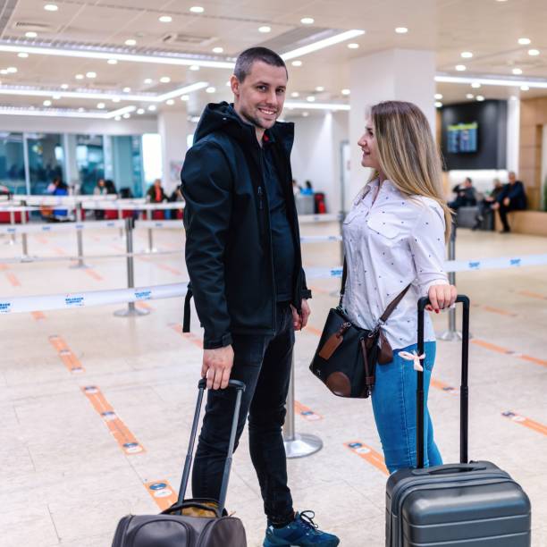 Couple at the international airport. stock photo