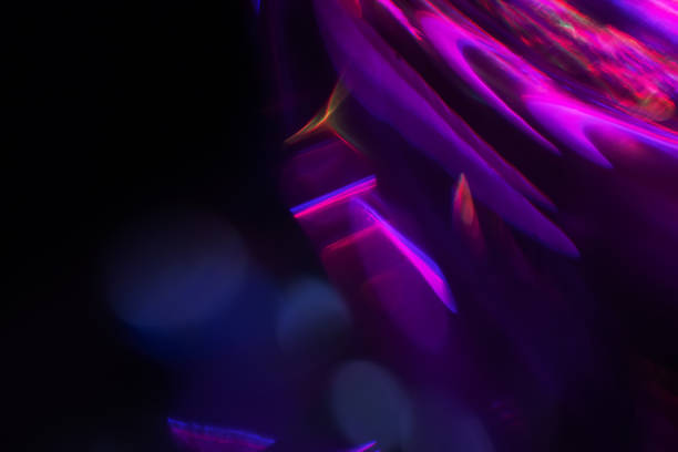 istock Abstract blurred colorful lens flare bokeh on black, 1483277493