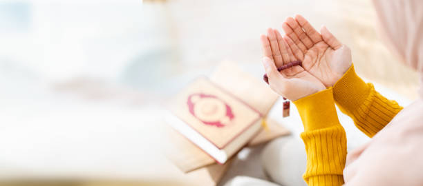 istock Muslim woman praying. 1483278140