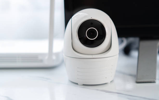 istock Digital security eye. A white round indoor CCTV surveillance camera monitoring security 1483280429