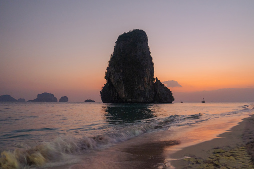 Idyllic Railey  beach surrounded by karst formations  on Krabi, Thailand at sunset