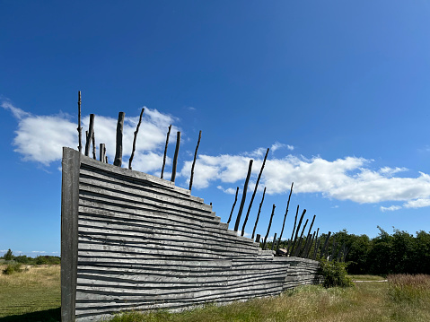 Noah's Ark - a huge wooden ship behind grass on a public recreational park area.
