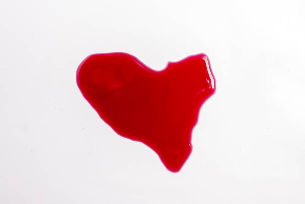 istock splashed wine on table heart shaped glass,cork and corkscrew isolated 1483291638