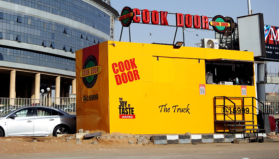 Cairo, Egypt, April 18 2023: Cook door street fast food truck, Cook Door is a chain of fast food restaurants based in Cairo, Egypt, one of Egypt's fast food chains founded in 1988, selective focus