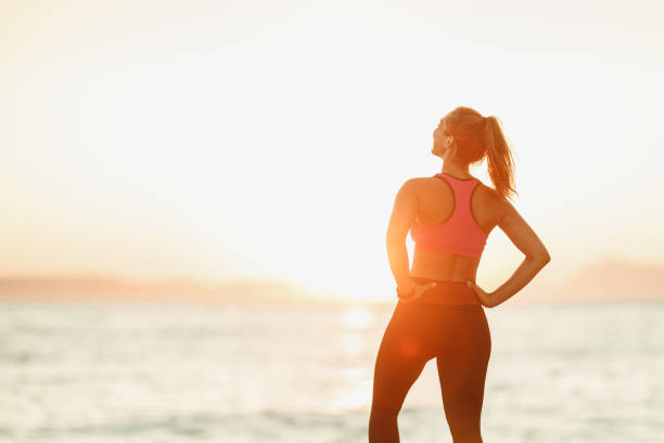istock Woman Relaxing After Exercise At The Beach 1483297246