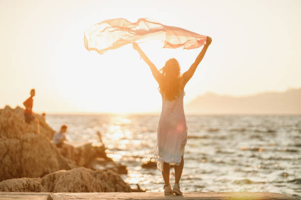 istock Woman Enjoying A Summer Day At The Beach 1483298229