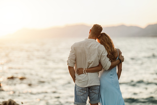 Couple looking to the landscape during a cruise travel