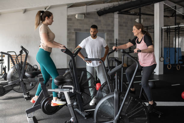 istock A group of people are training on exercise bikes. 1483298519