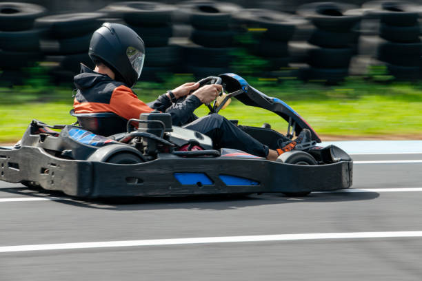 istock Man racing with a karting car on a sports track. 1483299727
