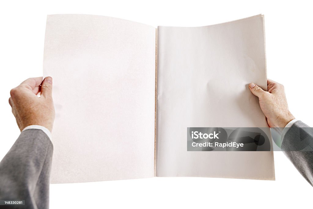 Businessman's hands hold blank newspaper Seen from over his shoulder, a businessman holds a blank, open newspaper, ready for your message. Shot with Canon EOS 1Ds Mark III. Newspaper Stock Photo