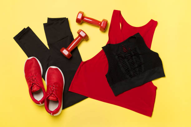 istock Black gym outfit on color background, top view 1483303016