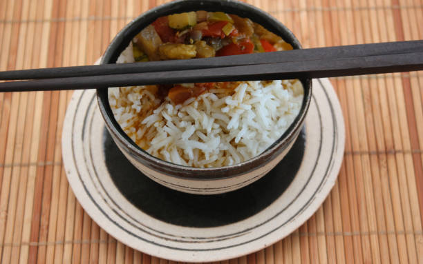 Boiled white rice served with ratatouille