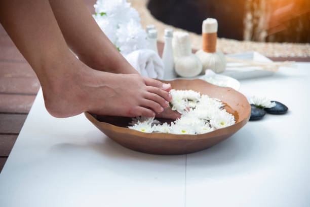 istock Female feet at foot spa procedure 1483304799